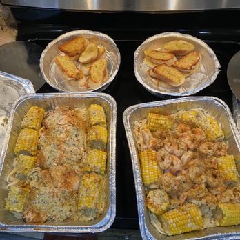 Melbourne Seafood Station - Two family value packs - one with chicken, corn and linguine and one with shrimp, corn and linguine and garlic bread. - Seafood Near Me - Melbourne, Florida Melbourne Seafood Station - Two family value packs - one with chicken, corn and linguine and one with shrimp, corn and linguine and garlic bread. - Seafood Near Me - Melbourne, Florida