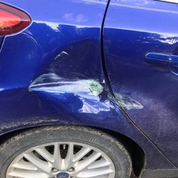Metro Sanitation and Express Services - This was the damage done when this company hit our car and decided NOT to handle it.