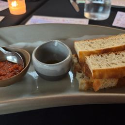 Warm Prager Bread served with Basil Olive Oil, Sun Dried Tomato Tapenade Warm Prager Bread served with Basil Olive Oil, Sun Dried Tomato Tapenade