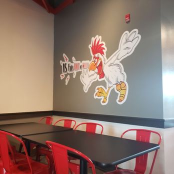 Blazing Bird - Aurora - a table and red chairs - Chicken Shop Near Me - Aurora, Colorado Blazing Bird - Aurora - a table and red chairs - Chicken Shop Near Me - Aurora, Colorado
