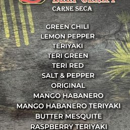 Partial Menu - not including monthly specials. - A menu board displaying different flavors of beef jerky at Sena's Beef Jerky, including options like Green Chili, Lemon Pepper, Teriyaki, and Mango Habanero.