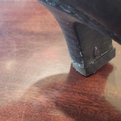 Famous Shoe Repair - Nail went in sideways through the side of the heel.