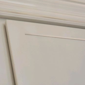 STL Design and Build - Yellow caulk for crown molding at top of cabinets - General Contractors Near Me - Maryland Heights, Missouri