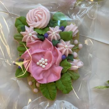 Baking by the Book - a cookie decorated with flowers - Bakeries Near Me