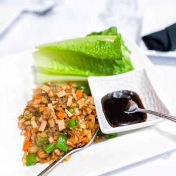 New Burma - a plate of food with lettuce and sauce - Burmese Near Me - San Francisco, California
