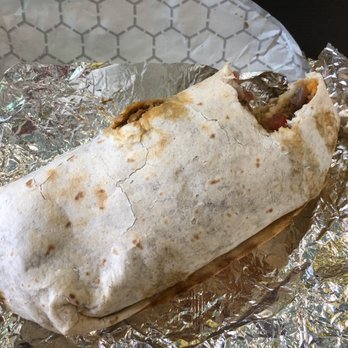 Yellow Bicycle Canteen - She takes big bites outta chorizo burritos! - Vegetarian Near Me - Philadelphia, Pennsylvania