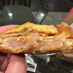 Arby's - Raw chicken bacon Swiss sandwich (with bottom bun removed).