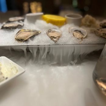 Monarch Chophouse - Kusshi oysters on ice, with dry ice below. - Steakhouses Near Me - Black Hawk, Colorado