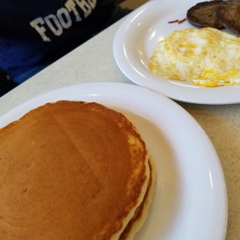 Citrus - Buttermilk pancakes with over hard eggs and sausage - American Near Me - Virginia Beach, Virginia