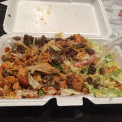 New York Halal Kart - My classic combo over rice w a little of both sauces. Can't beat it