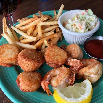 Griff's On the Bay - Scallops and shrimp, coleslaw and french fries. Glass of red wine to round it all out. - Seafood Near Me - Winchester Bay, Oregon Griff's On the Bay - Scallops and shrimp, coleslaw and french fries. Glass of red wine to round it all out. - Seafood Near Me - Winchester Bay, Oregon