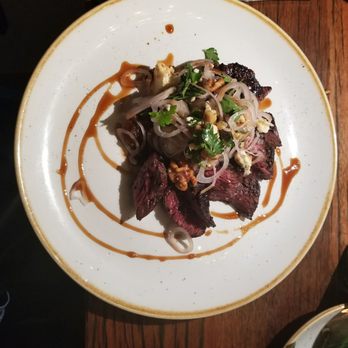 FlintCreek Cattle - Durham Ranch Bison Hanger Steak, roasted walnuts, shallot-parsley salad, cashel blue, onion marmalade - New American Near Me - Seattle, Washington