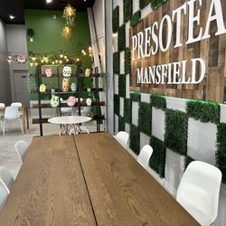 Presotea Mansfield - Restaurant sign and table