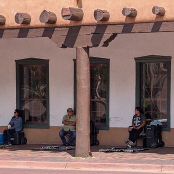 Santa Fe Plaza - This wall near the plaza has native American vendors selling jewelry, arts, and crafts - Landmarks & Historical Buildings Near Me - Santa Fe, New Mexico