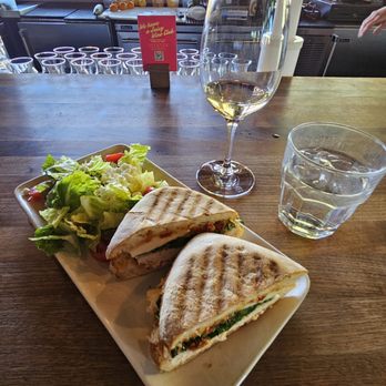 Postino Broadway - Chicken and Mozzarella Panini on Ciabatta with New Zealand Sauvignon Blanc - Wine Bars Near Me - Denver, Colorado