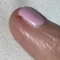 Nail Boutique and Spa - I got my nails done on Wednesday and this picture was taken on Friday. It's still red.