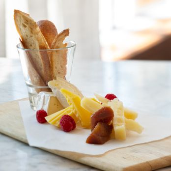 Coastal Manor - a glass of fruit and bread on a cutting board - Mediterranean Near Me - San Jose, California Coastal Manor - a glass of fruit and bread on a cutting board - Mediterranean Near Me - San Jose, California