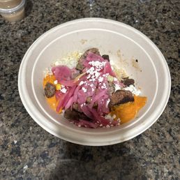 Grain bowl with steak and lamb meatballs.