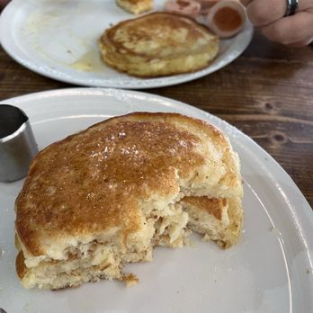 Mr. Pancake - Pancakes half eaten... yum! "Sausage" on my husband's plate. - Pancakes Near Me - Munich, BY