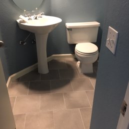 Half bathroom with new tile flooring Half bathroom with new tile flooring