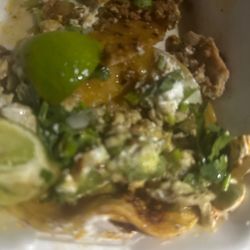 Cesar's Tacos - Half finished campechano and 1 pollo taco with crema, cilantro and onions.