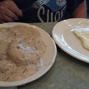 SKD Kitchen And Drinks - Sausage gravy and biscuits meal at Skidders - Pizza Near Me - Saint Pete Beach, Florida SKD Kitchen And Drinks - Sausage gravy and biscuits meal at Skidders - Pizza Near Me - Saint Pete Beach, Florida