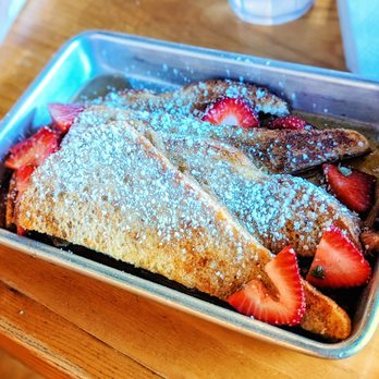 En Su Boca - Torrijas  Three(?) slices of Spanish-style French toast with tamarind-rum maple syrup, powdered sugar, and fresh rotating fruit. - Mexican Near Me - Richmond, Virginia