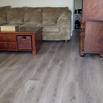 Zappia's Flooring - a living room with a couch and a coffee table - Flooring Near Me Zappia's Flooring - a living room with a couch and a coffee table - Flooring Near Me