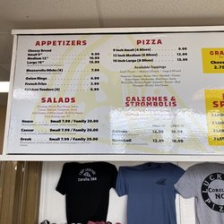 Lucky's Pizza & Sub House - Menu mounted on the wall