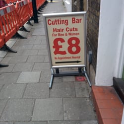 Angel Cutting Bar - Sign out front
