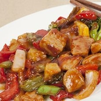 China Buffet - a plate of stir fried chicken and vegetables with chopsticks - Cantonese Near Me - Mauston, Wisconsin