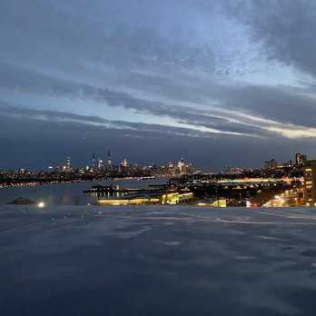 SoJo Spa Club - Nighttime views from the infinity pool - Saunas Near Me - Edgewater, New Jersey SoJo Spa Club - Nighttime views from the infinity pool - Saunas Near Me - Edgewater, New Jersey