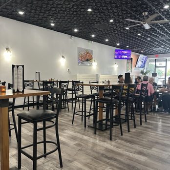Live Fire Chefs - Dining area. High tops and booths on both sides - Caterers Near Me - Ocala, Florida