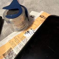 US Post Office - USPS rep-UFN: 358212-0202 did not want to the use the available tape, that was located to the "right of shoulder" for a paying customer.
