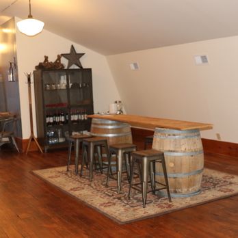 Usurious Wines - a room with a wine barrel table - Wine Tasting Room Near Me - Leavenworth, Washington Usurious Wines - a room with a wine barrel table - Wine Tasting Room Near Me - Leavenworth, Washington