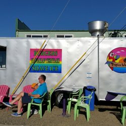 Tropics Island Grill - Seating area in front of the food truck.