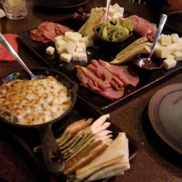 Charcuterie. Board of 6. Sopresata, quatro formagio, capicola, prosciutto, fontina, artisan cheese. Spinach artichoke dip in the pan. Charcuterie. Board of 6. Sopresata, quatro formagio, capicola, prosciutto, fontina, artisan cheese. Spinach artichoke dip in the pan.