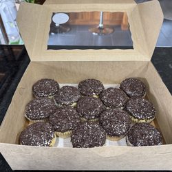 Temptations Cupcakes - Bordeaux cream cupcakes. Looks like a child frosted and decorated these. Tastes like a regular white cupcake.