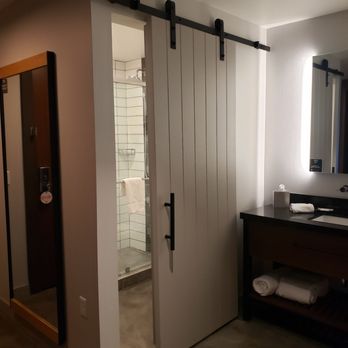 Canopy by Hilton Tempe Downtown - Barn door separates the shower/toilet area. Modern but not functional when the door barely closes - Hotels Near Me - Tempe, Arizona Canopy by Hilton Tempe Downtown - Barn door separates the shower/toilet area. Modern but not functional when the door barely closes - Hotels Near Me - Tempe, Arizona