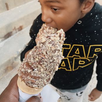 La Diperie - a little boy eating an ice cream cone - Ice Cream & Frozen Yogurt Near Me - Montreal, Quebec