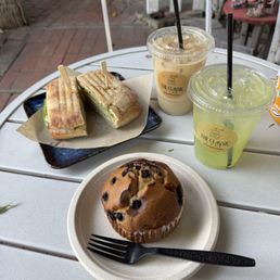Pesto turkey panini, blueberry muffin, chai latte, forest lemonade