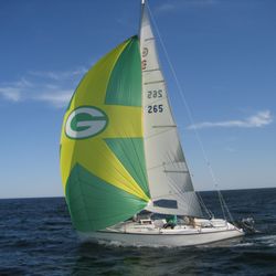 Floods Cove - Triple Lindy sailing into Flood's Cove with the spinnaker