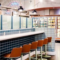 Interior of Birdcall Whole Foods Belmar restaurant. This location has a small dining room with bar seating.