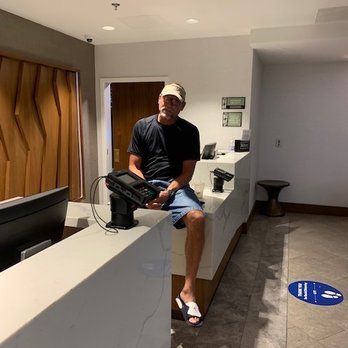 Embassy Suites by Hilton Tysons Corner - Some guy sitting on the counter during checkin... - Hotels Near Me - Vienna, Virginia Embassy Suites by Hilton Tysons Corner - Some guy sitting on the counter during checkin... - Hotels Near Me - Vienna, Virginia