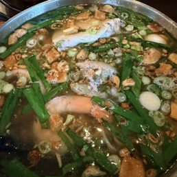 Egg noodle soup w/shrimp, squid, fish balls & pork Broth was savory & good Egg noodle soup w/shrimp, squid, fish balls & pork Broth was savory & good