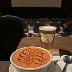 Gilson Cafe/Cinema - Bowl of tomato and roasted red pepper bisques with a Norbrook Farm Brewery Mt Pisgah IPA. Delish and artfully topped with balsamic glaze!