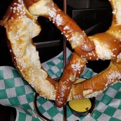 The Patio on Main - Gigantic pretzel appetizer to die for acompanied with beer cheese for dipping And mustard