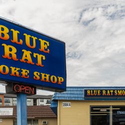 Blue Rat - blue rat smoke shop store front from side parking