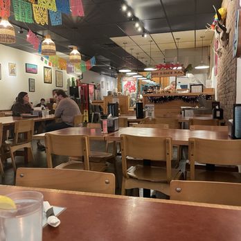 Roosters - Part of the small dining area. - Tacos Near Me - Mobile, Alabama