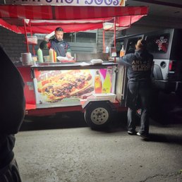 a woman ordering hot dogs